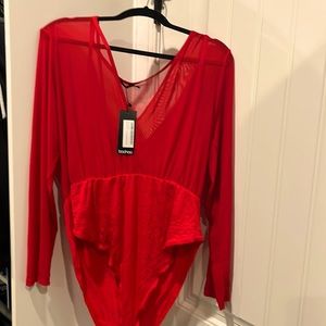 New with tags. Red bodysuit with thin, mesh upper. Snap closure between legs.